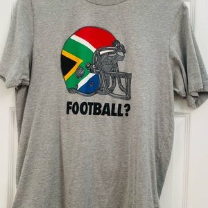 T. SHRIT WITH THE GRAPHIC OF FOOTBALL HELMET WITH SOUTH AFRECAN FLAG